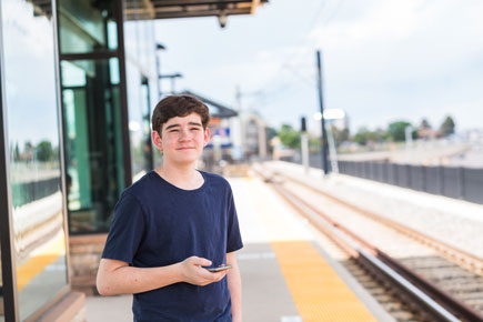 teen at rail station