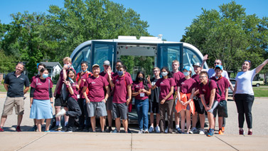 CAV camp students with an automated shuttle