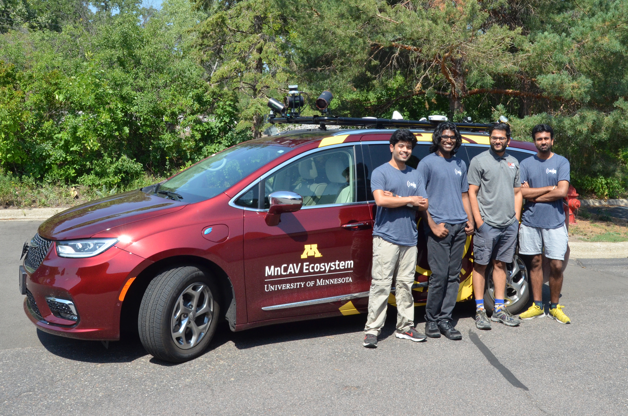 2023 VSI Labs interns standing with the MnCAV automated vehicle