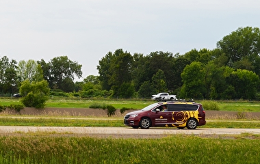 MnCAV vehicle driving on the test track at MnROAD