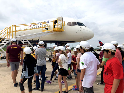 students in line for plane