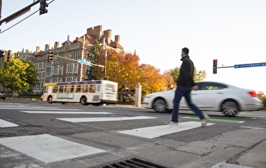 Bus, car, and pedestrian on University Avenue
