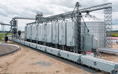 Train cars being loaded with grain