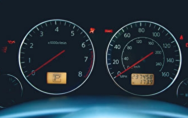 Close up of gauges on a vehicle dashboard