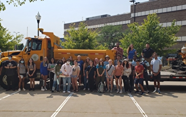 Campers in front of a large truck at Discover STEM