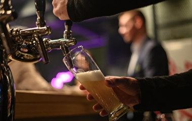 Bartender pouring a draft beer