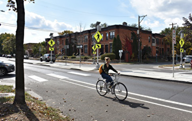 Bicyclist riding on a paved road