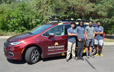 2023 VSI Labs interns standing with the MnCAV automated vehicle