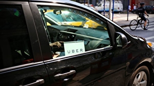 Car with an Uber sign in the window