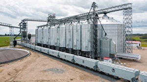 Train cars being loaded with grain