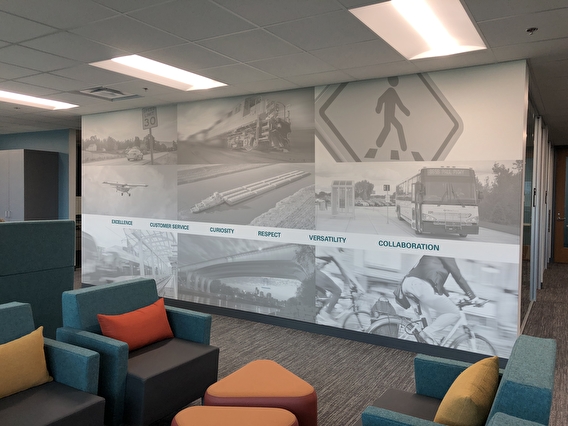 Black and white mural of transportation scenes in CTS office