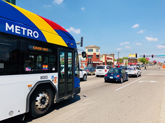Metro Transit bus stopped in traffic at a red light