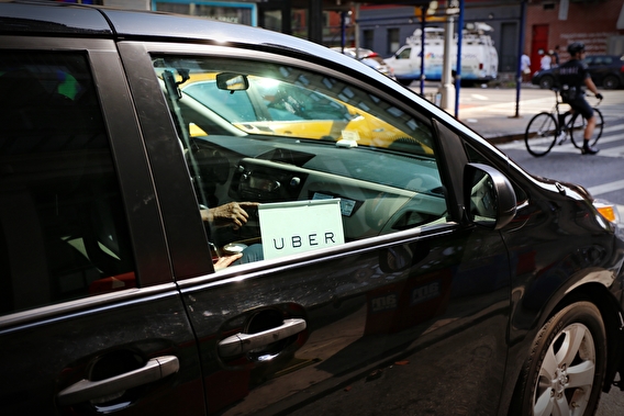 Car with an Uber sign in the window