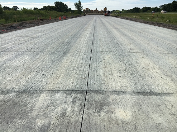 Section of concrete pavement roadway