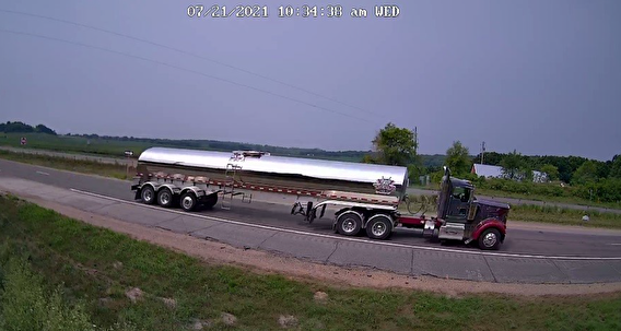 Camera still showing a semi truck on a roadway