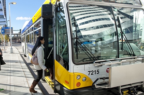 Woman boarding a Metro Transit bus