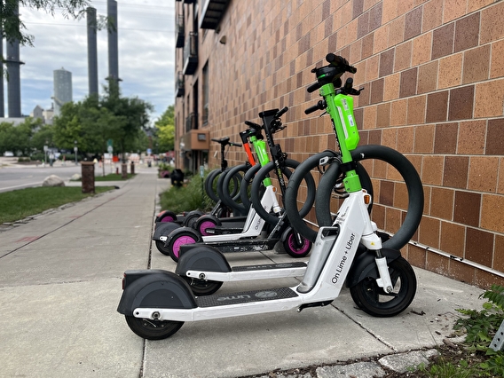 Lime scooters parked next to a building