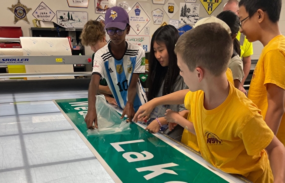 Students get their hands on a freshly made sign at Hennepin County