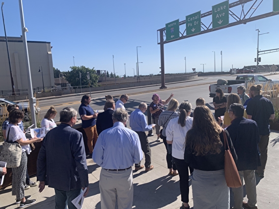 Event attendees on a walking tour next to I-35 in Duluth