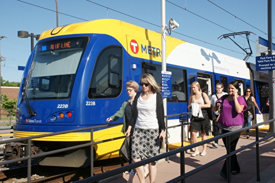 Blue Line train at a station with passengers disembarking