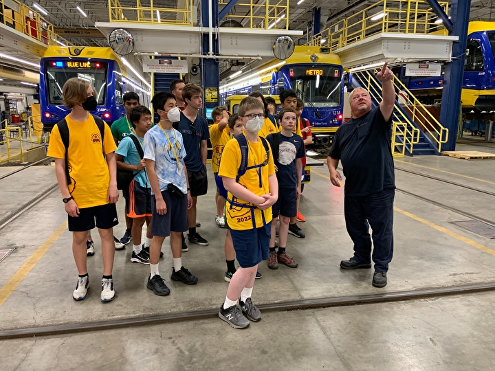Students learning about light-rail trains in a Metro Transit garage
