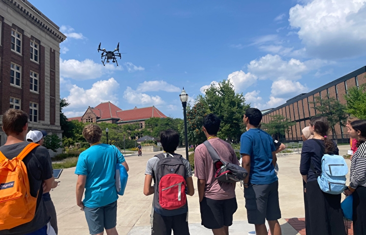 Campers watching a drone demo