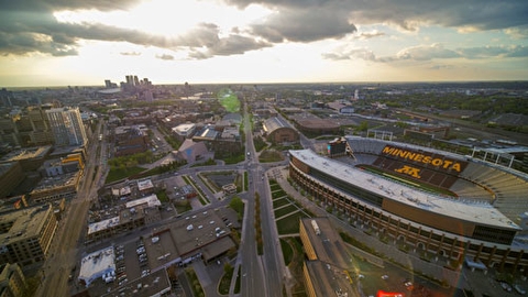 Overhead image of U of M East Bank campus, with Minneapolis skyline in the distance