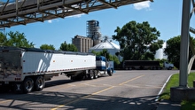 Semi truck waiting to be loaded at a manufacturing facility