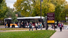 Bus and pedestrians on U of M St. Paul campus